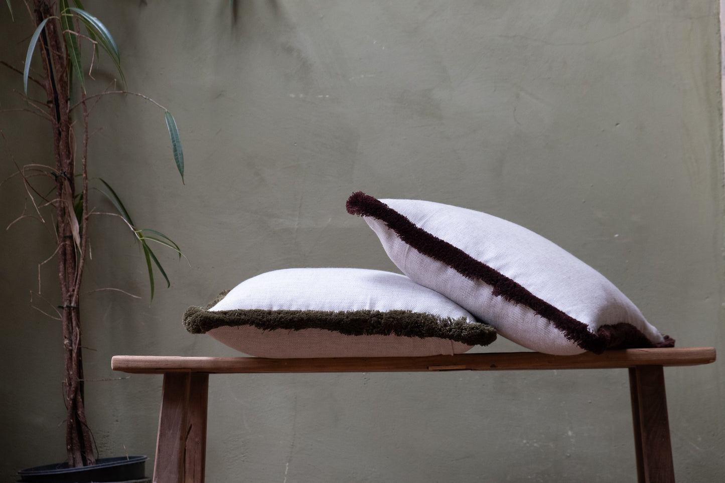 Neutral Herringbone Linen cushions stacked. 100% Irish Linen Cushion with Deep Olive Green fringing