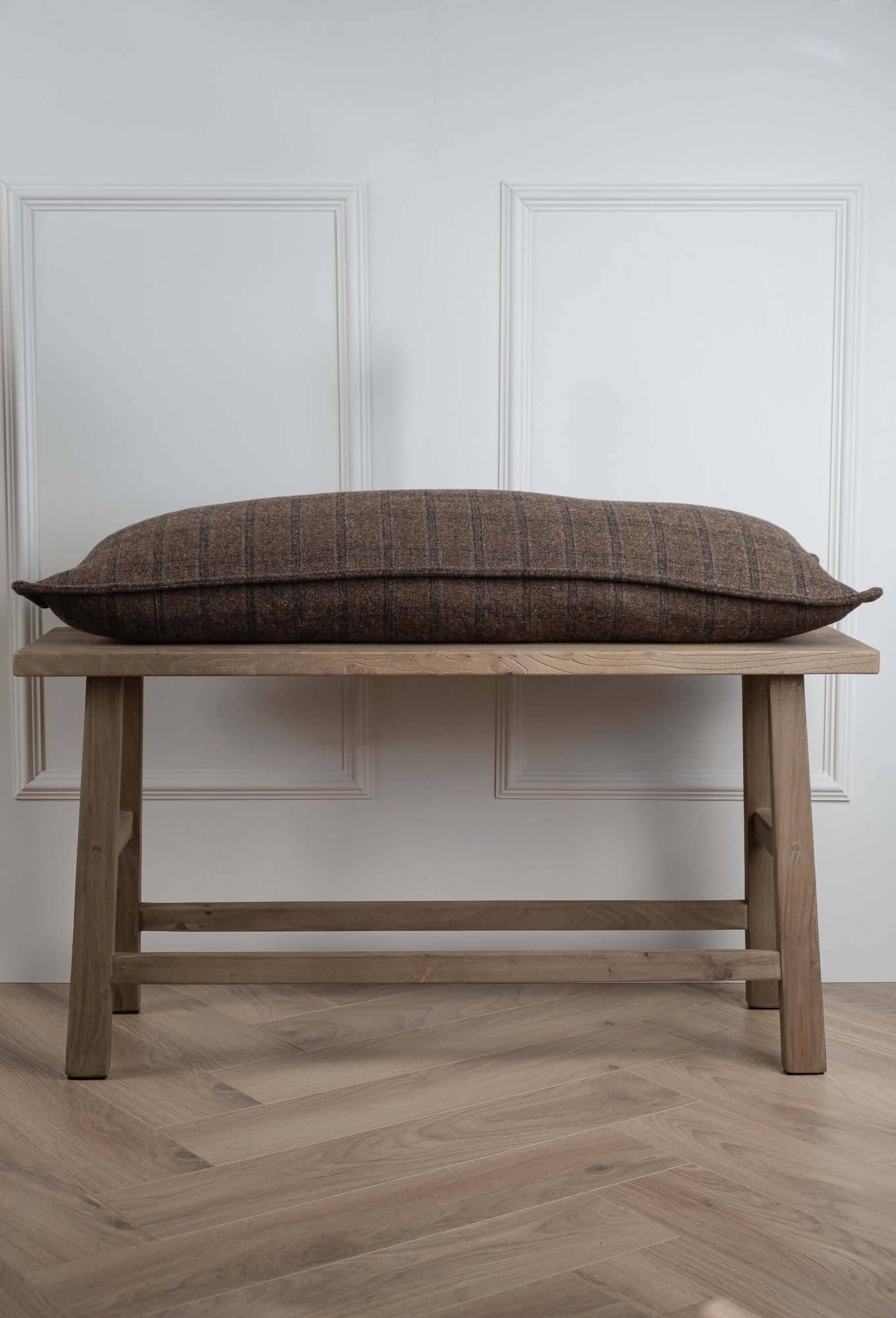 Side view of a Brown Check Large lumbar bolster cushion. Long Rectangle cushion. Made in Ireland. Irish Tweed