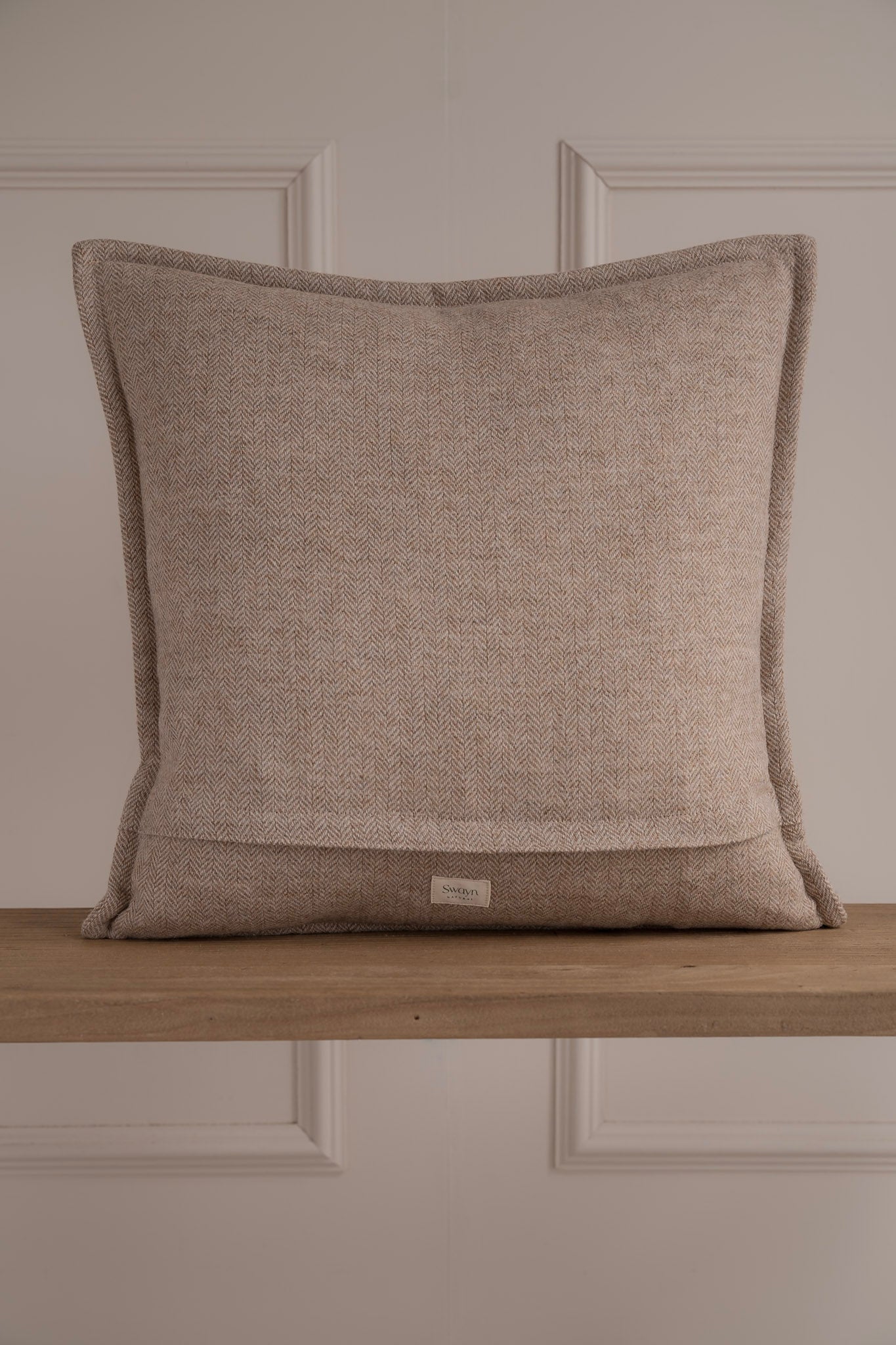 Neutral Natural Ceam Beige coloured Herringbone tweed cushion with a stitched boarder 