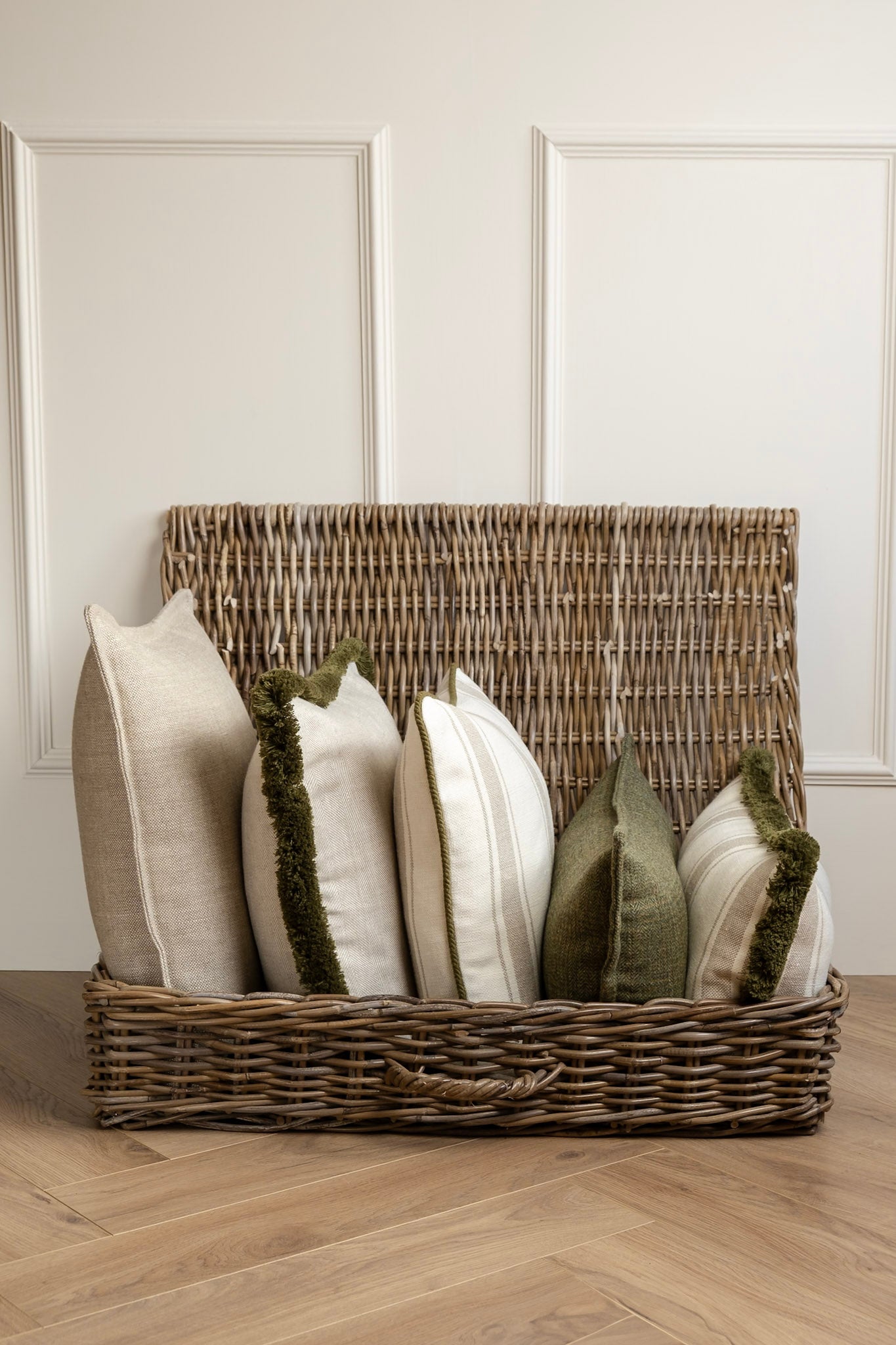 A selection of neutral and Green cushions. Featuring fringes and piping details. Athletically pleasing, High Quality cushions that will last. Made in Ireland. Linen and Tweed cushions