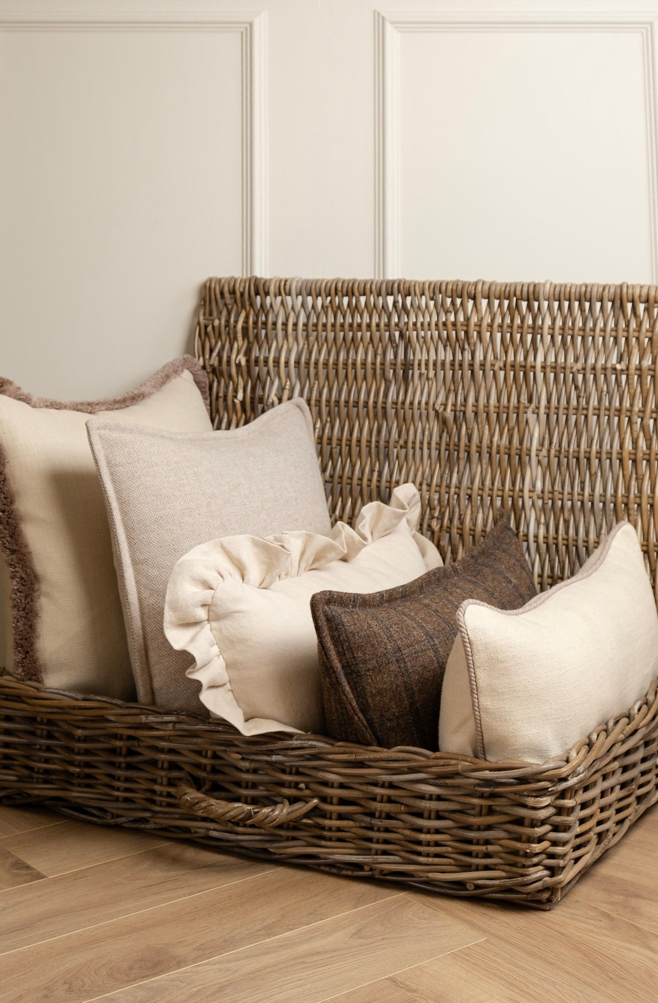 A selection of Neutral Creams and Brown cushions featuring fun edgings. Fringe details, frills and stitched boarder edging. Made in Ireland. Irish Tweed, Irish Linen. 